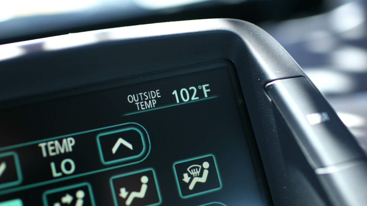 A car thermometer displays an outside temperature of 102 degrees June 20, 2008 in Petaluma, California.