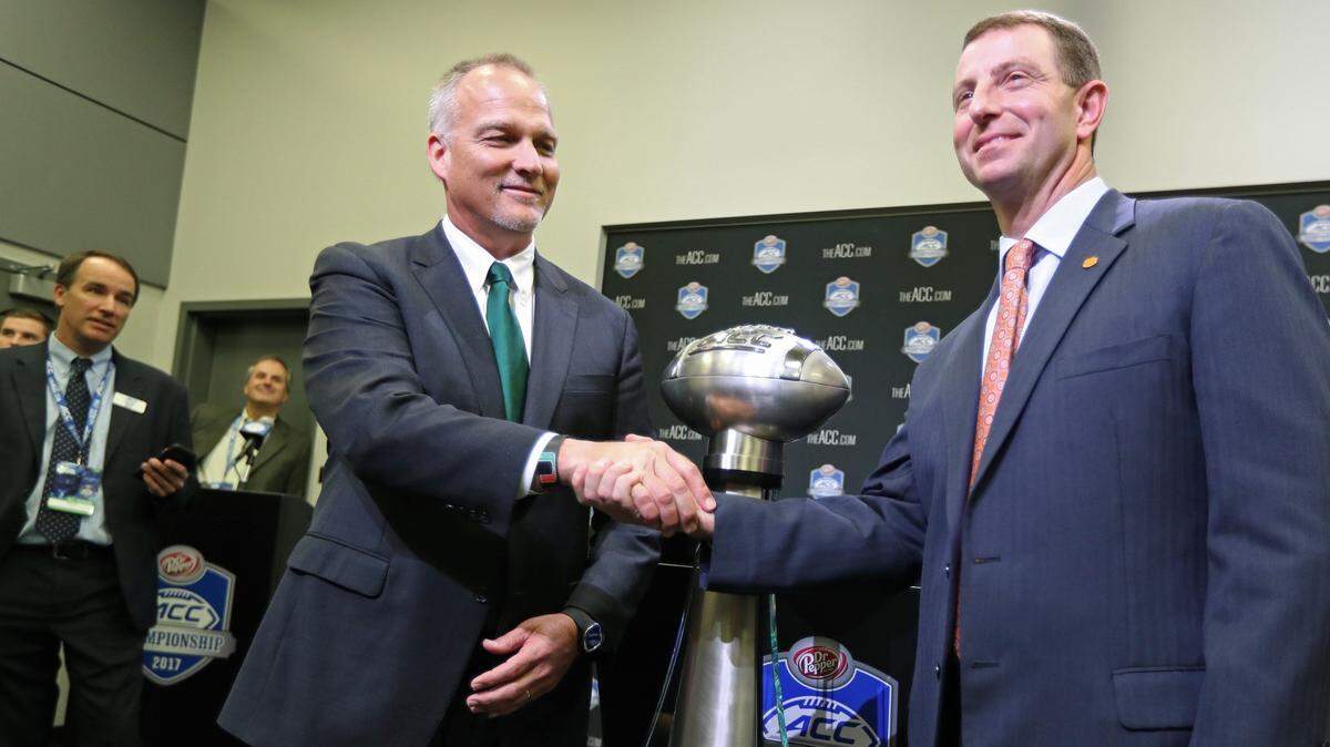 Miami Hurricanes head coach Mark Richt and Clemson head coach Dabo Swinney during press conference at Bank of America Stadium on Friday, December 1, 2017. 