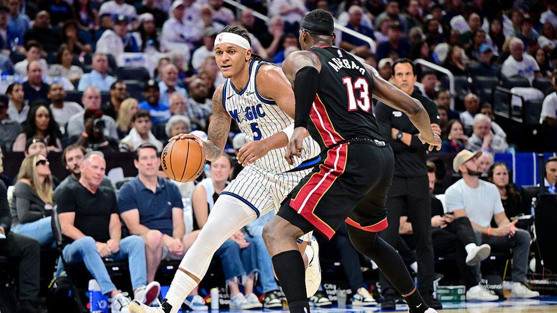 Paolo Banchero #5 of the Orlando Magic dribbles the ball to the basket against Bam Adebayo #13 of the Miami Heat in the second half of the game at Kia Center on October 22, 2025 in Orlando.