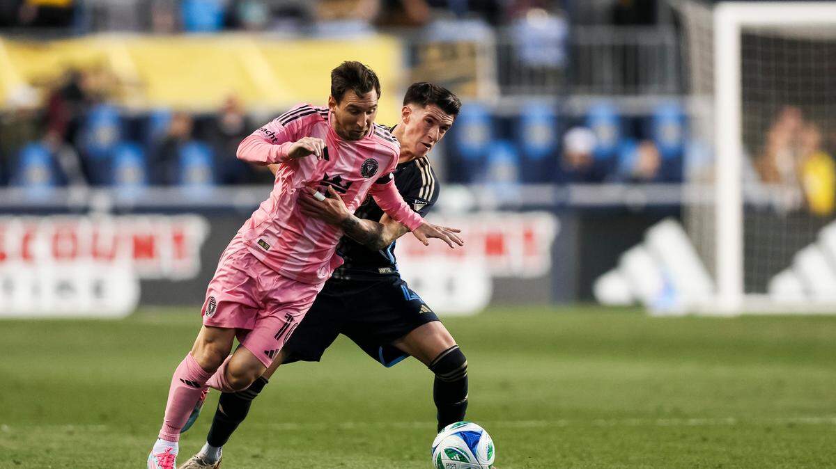 May 24, 2025; Chester, Pennsylvania, USA; Inter Miami forward Lionel Messi (10) dribbles against Philadelphia Union midfielder Jovan Lukić (4) during the first half at Subaru Park. Mandatory Credit: Caean Couto-Imagn Images