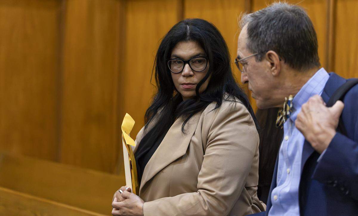 Former Miami-Dade School Board member Lubby Navarro and her attorney, Ben Kuehne, arrive to court before entering a plea deal at the Richard E. Gerstein Justice Building on Tuesday, April 14, 2026, in Miami, Fla. Navarro plead guilty to spending up to $100,000 of district funds while in office.