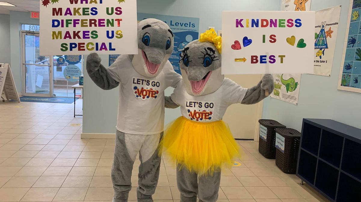 Sunny and Sol, dolphin mascots at Miami’s Ocaquatics swim school, square
off for the election of Swim School president. Project organizers said they hope it helps the children gain a greater appreciation for democracy. 