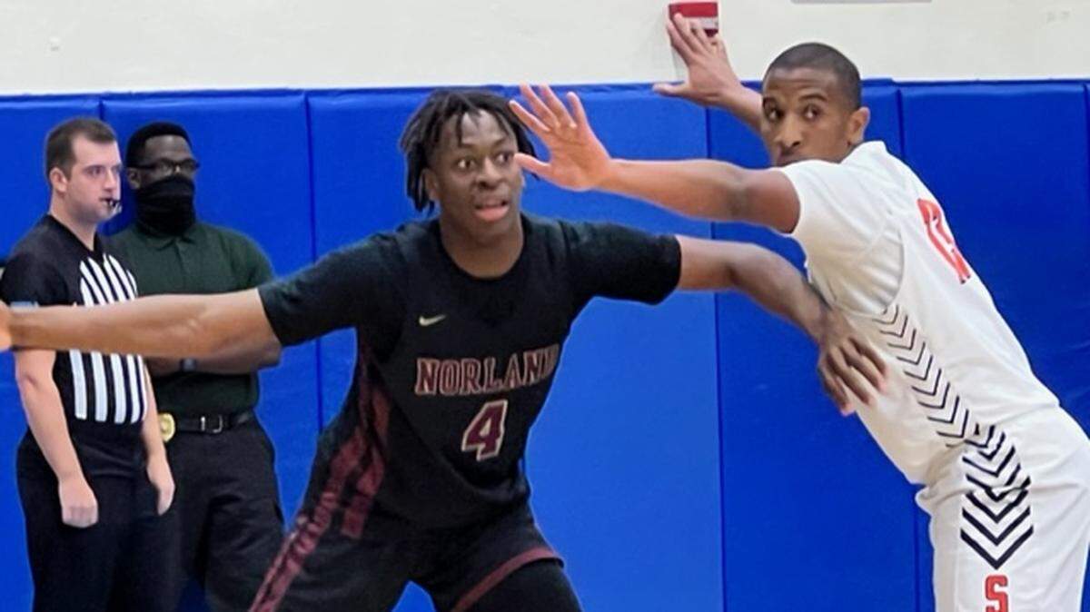 Norland sophomore Marcus Allen (left) is defended by Stranahan senior Houston Culpepper (right) in the first quarter of the Class 5A regional final on Friday.
