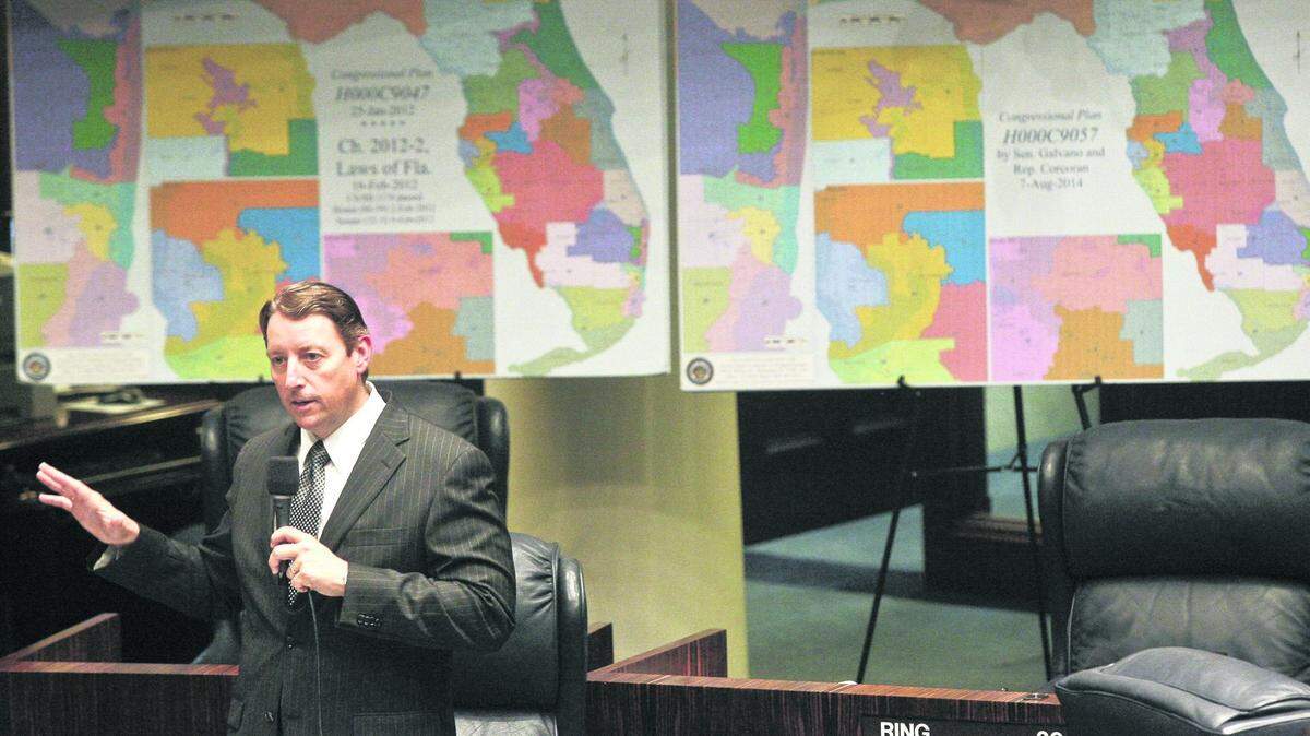 In the last round of redistricting, Senate Reapportionment Chairman Sen. Bill Galvano, R-Bradenton, discusses an amendment on the floor of the Senate in August 2014, at the Capitol in Tallahassee. Behind him are maps of the 2012 Florida congressional districts, left, and the redrawn districts he proposed in Senate Bill 2.