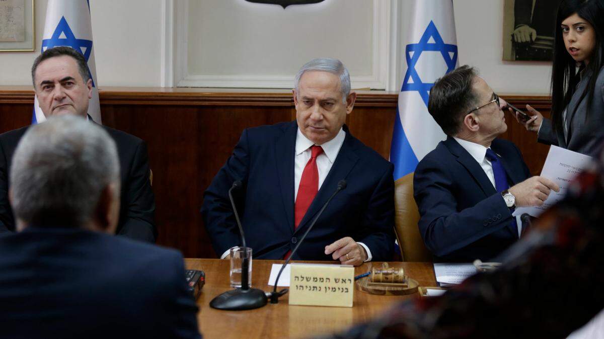 Israeli Prime Minister Benjamin Netanyahu, center, convenes his cabinet for weekly meeting in Jerusalem, Sunday, Jan. 13, 2019.
