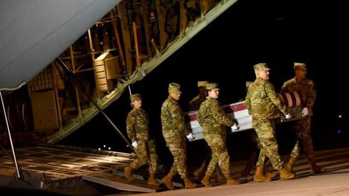 Coffins bearing the young sailors killed in an attack on the Naval Air Station in Pensacola, were transferred to Dover Air Force Base in Delaware.