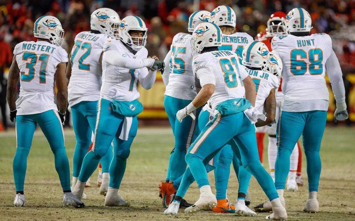 Miami Dolphins quarterback Tua Tagovailoa (1) calls out as the huddle breaks up during the second half against the Kansas City Chiefs at GEHA Field at Arrowhead Stadium in Kansas City, Missouri, on Saturday, January 13, 2024.