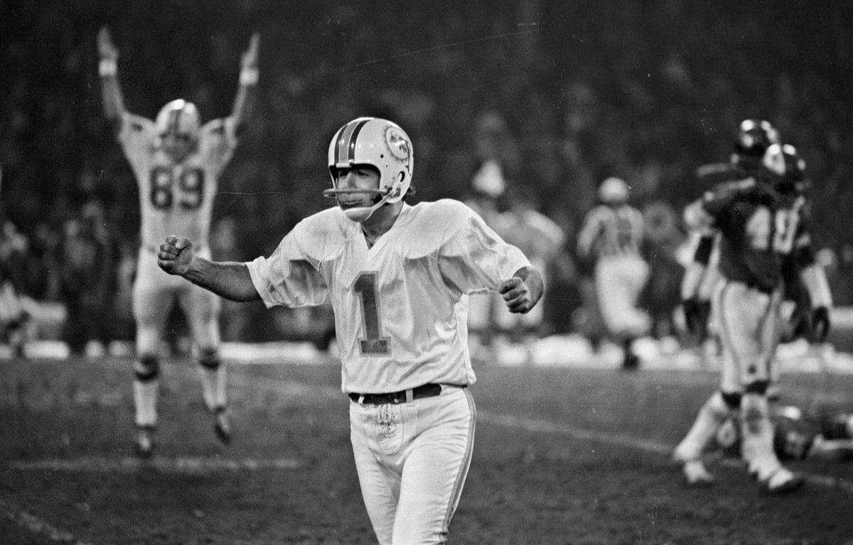Professional footballs longest game played December 25th 1971 at Municipal Stadium, Kansas City, ....between the Miami Dolphins and the Kansas City Chiefs. Here, kincker #1 Garo Yepremian feels the joy as his holder,#89 Karl Noonan jimps for joy after the winning field goal...This was a playoff game that sent the Dolphins to the Super bowl with the Cowboys. Pineda Photo