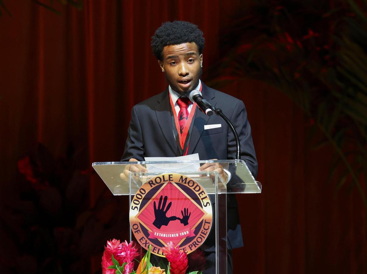 DeAnthony Solomon, 18, senior at Miami Central Senior High School, gives the 5000 Role Models prayer during the scholarship ceremony for the Wilson Scholars of the 5000 Role Models of Excellence Program on Sunday, June 5, 2022 at the Adrienne Arsht Center in downtown Miami. The program gives young Black men mentorship.