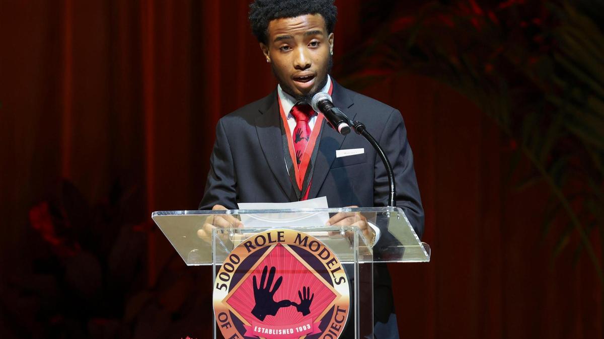 DeAnthony Solomon, 18, senior at Miami Central Senior High School, gives the 5000 Role Models prayer during the scholarship ceremony for the Wilson Scholars of the 5000 Role Models of Excellence Program on Sunday, June 5, 2022 at the Adrienne Arsht Center in downtown Miami. The program gives young Black men mentorship.
