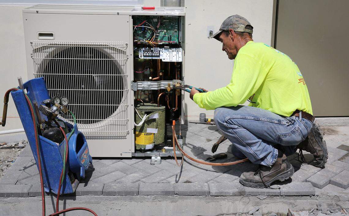 Bill Maler works on installing an air conditioning unit at a new building under construction at the ARPEC training center in Sweetwater  July 26, 2018. Maler attended the ARPEC training center 33 years ago and has been happy with the salary and benefits the program has afforded him.
