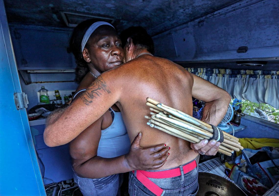 Vancel Johnson and Roberto Garcia, both 53 and convicted child sex offenders, embrace at the encampment they call home at 3600 NW 48th St. Garcia described himself as a sick person needing treatment, not a predator looking for victims. He said he was convicted of sexually battering his girlfriend’s daughter in 2008, under 12 years old at the time.