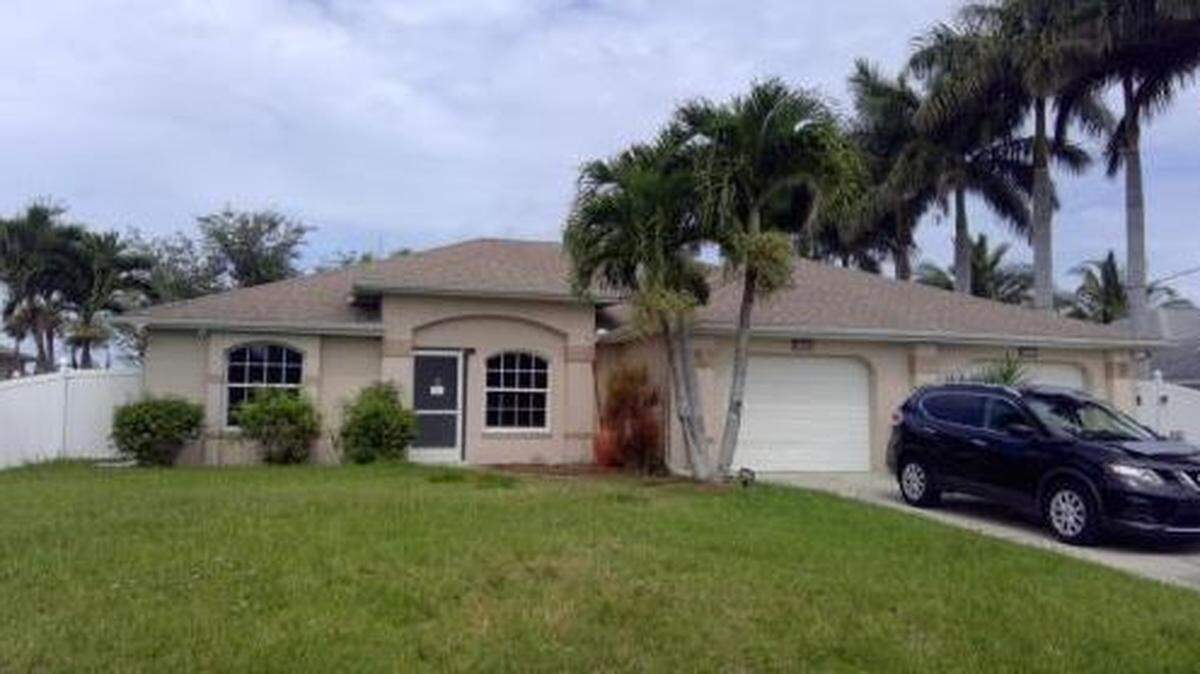 A May 2021 photo of the Cape Coral house and the 2016 Nissan Rogue that registered nurse Brittany Lukasik bought after ripping off a 92-year-old woman in her care.