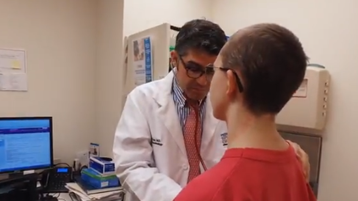 Dr. Alejandro Diaz, a pediatric endocrinologist at Nicklaus Children’s Hospital who works with children on gender identity issues, talks to a patient.