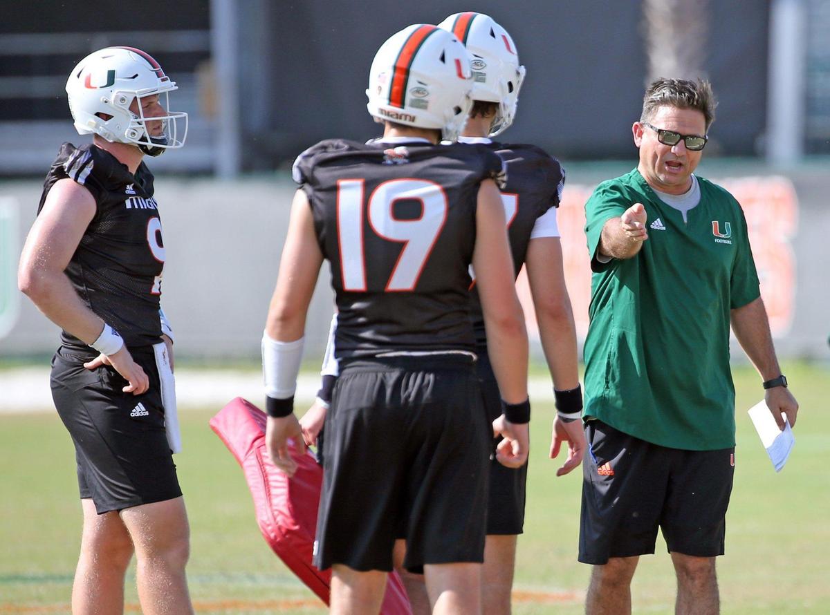 Miami Hurricanes offensive coordinator Shannon Dawson works with the quarterbacks during practice at the University of Miami’s Greentree Field on Tuesday, March 7, 2023.