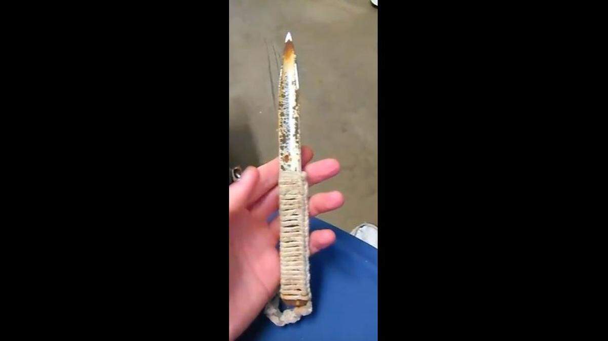 A prisoner at Martin Correctional Institution handles a homemade knife, one of the countless contraband items circulating in the prison.