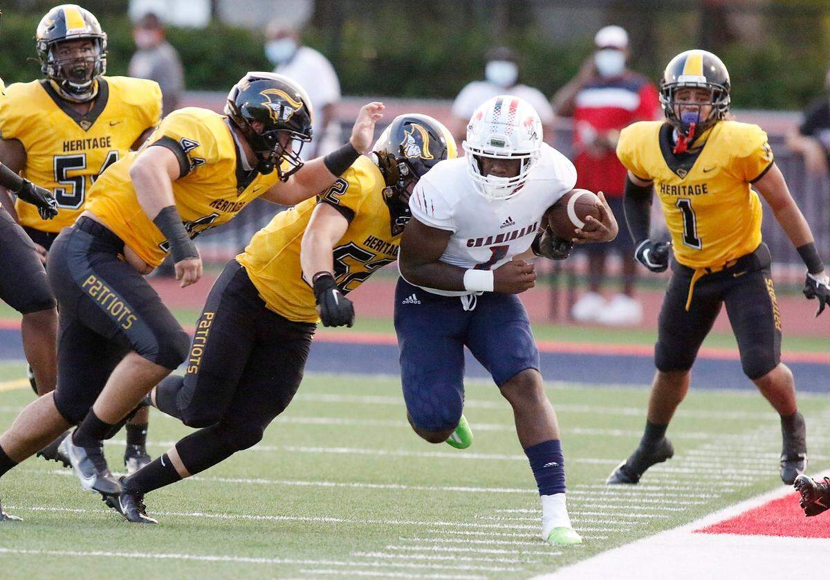 American Heritage Patriots defenders close in on Chaminade-Madonna Lions running back Thaddius Franklin (1) during the football game Friday, September 17, 2020 in Hollywood