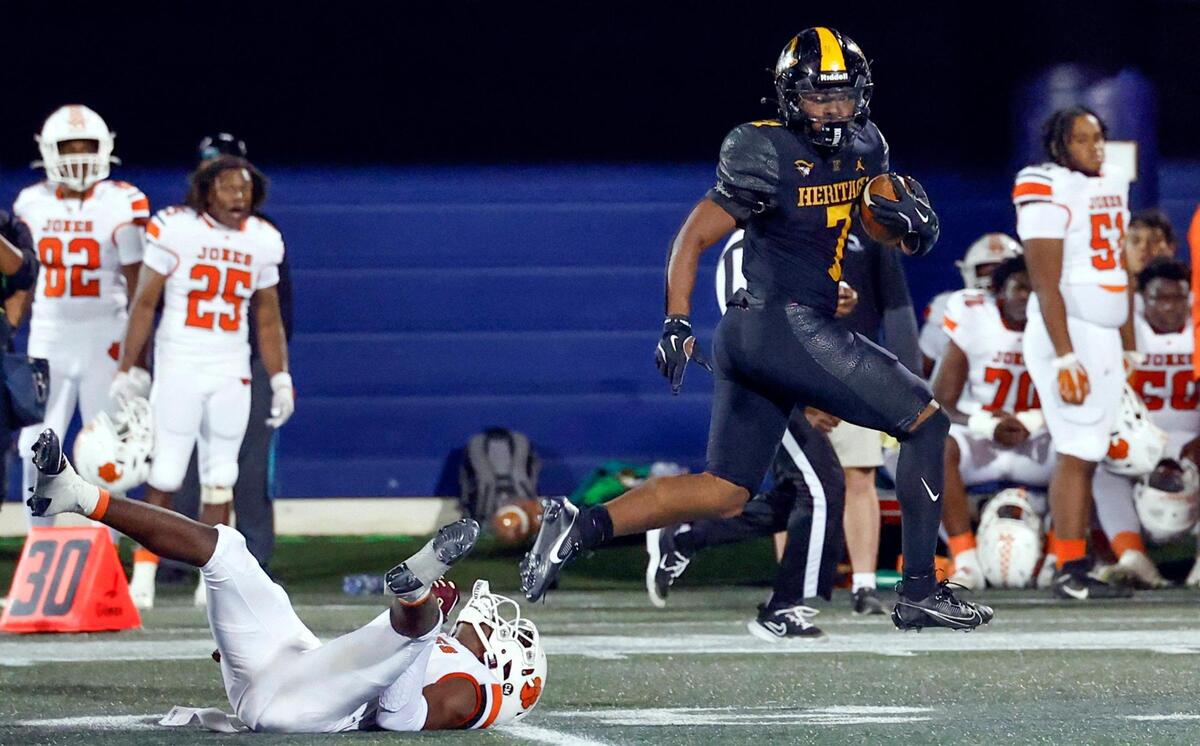 American Heritage running back Byron Louis (7) runs in to score against Jones High School in the second half during the Florida High School Football State Championships - Class 4A game at Pitbull Stadium on the campus of Florida International University in Miami, Florida, on Friday, December 13, 2024.