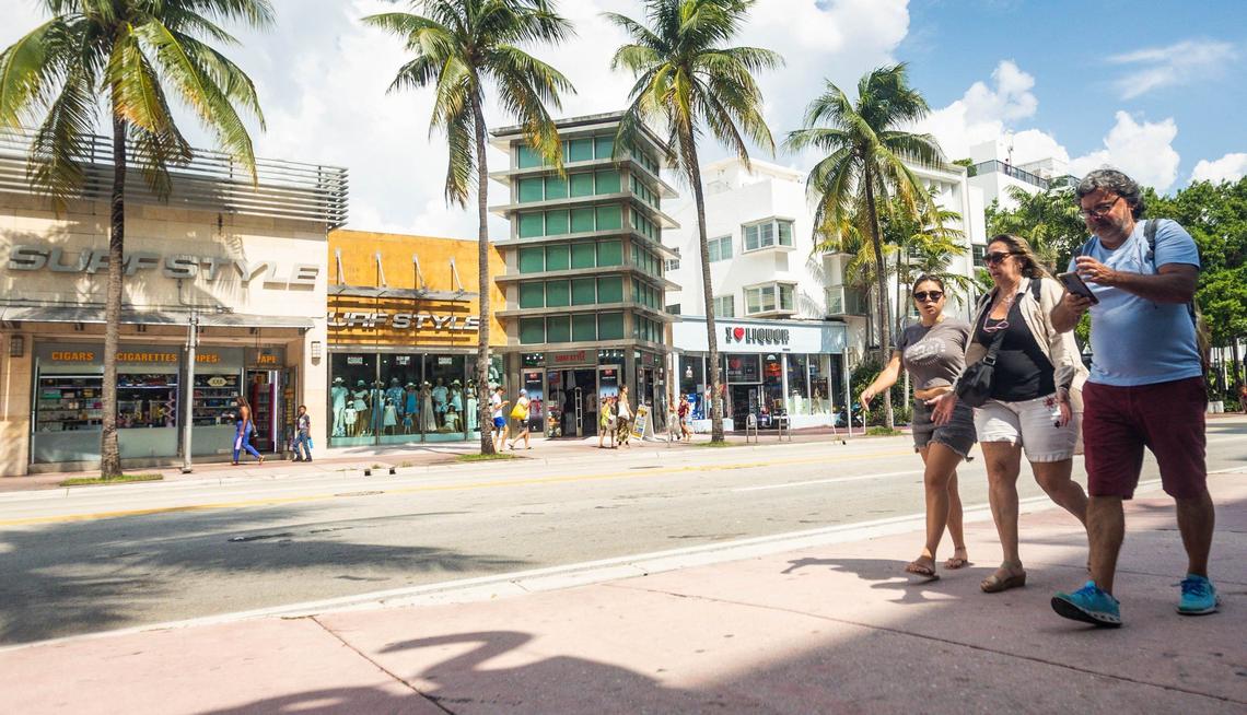 A trio of visitors walk past the Sagamore Hotel, which is teaming with the Ritz-Carlton in a proposal that would add a 15-story luxury condo to hotel row on Collins Avenue. The neighboring National hotel is fighting the plan, which also includes a $12 million makeover of the aging 100 block of Lincoln Road. .