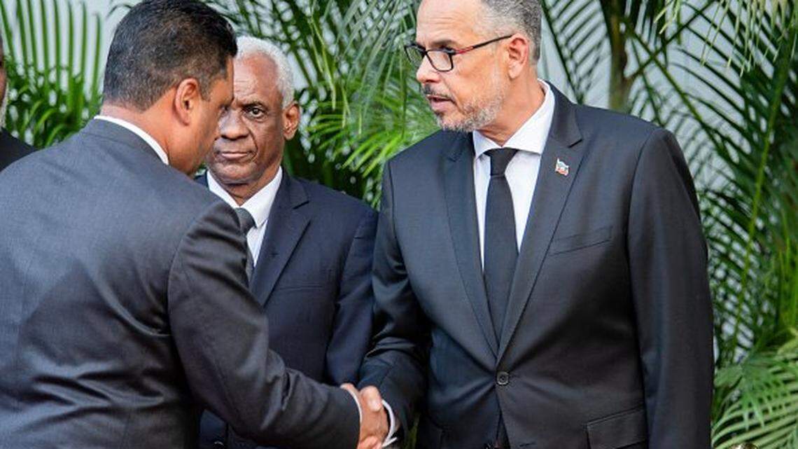 Chairman of the Transitional Presidential Council of Haiti, Laurent Saint-Cyr, greets acting Prime Minister, Prime Minister Alix Didier Fils-Aime, during a tribute to the victims of the January 12, 2010 earthquake in Port-au-Prince, Haiti, on January 12, 2026. (Photo by Clarens SIFFROY / AFP via Getty Images)