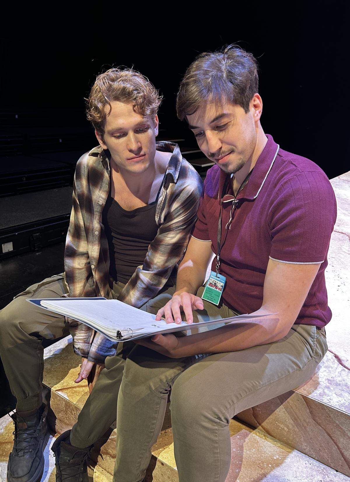 Aidan Neal and Larry Toyter review their lines during rehearsals.