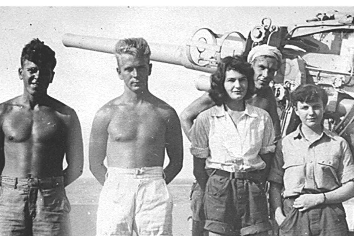 Jean Pugh, second from right, aboard a World War II warship.