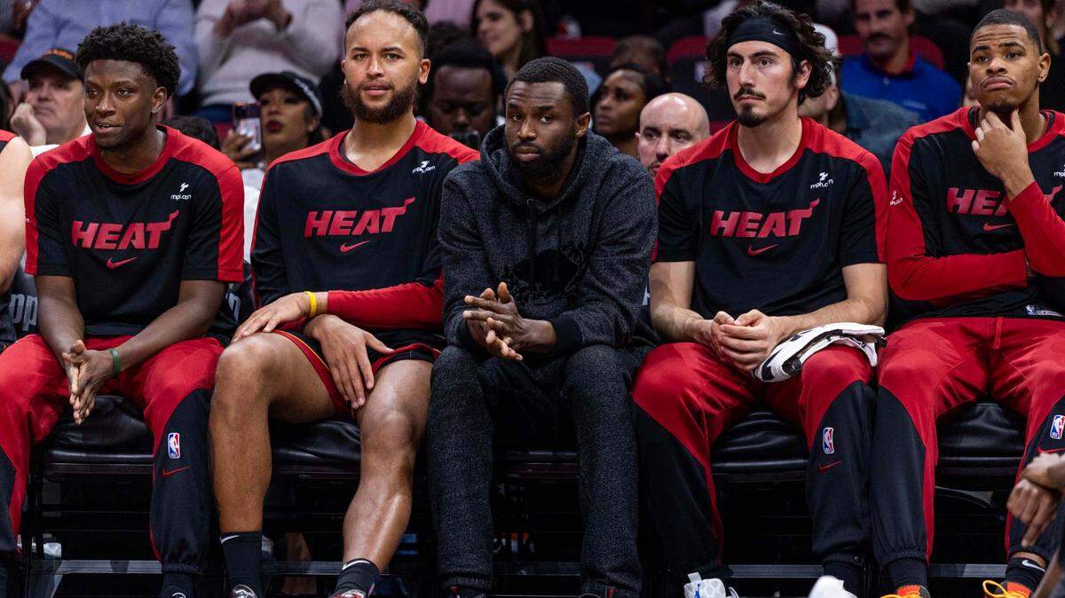 Miami Heat forward Andrew Wiggins (22) sits on the bench during the second half of an NBA game against the Memphis Grizzlies at Kaseya Center on April 3, 2025, in Miami.