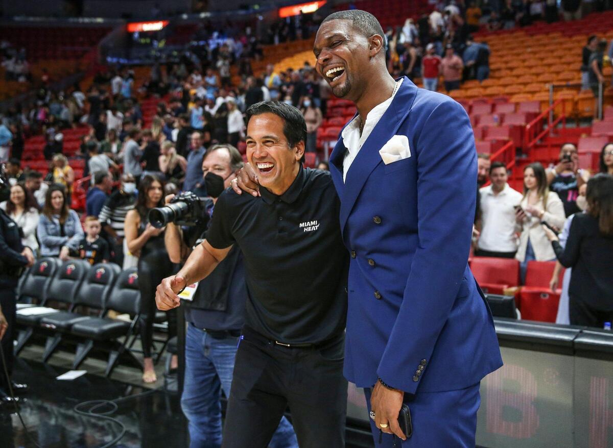 Miami Heat coach Erik Spoelstra meets up with former Heat player Chris Bosh after the game against the Oklahoma City Thunder at FTX Arena in Miami on Friday, March 18, 2022.