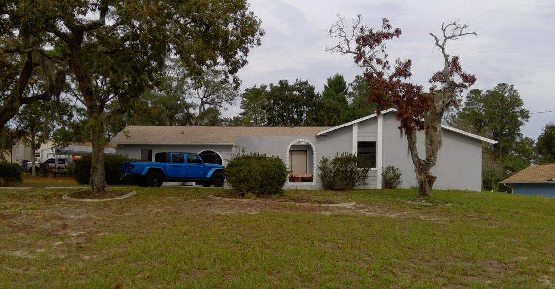 The home in Spring Hill the couple is accused of buying, according to the superseding indictment.