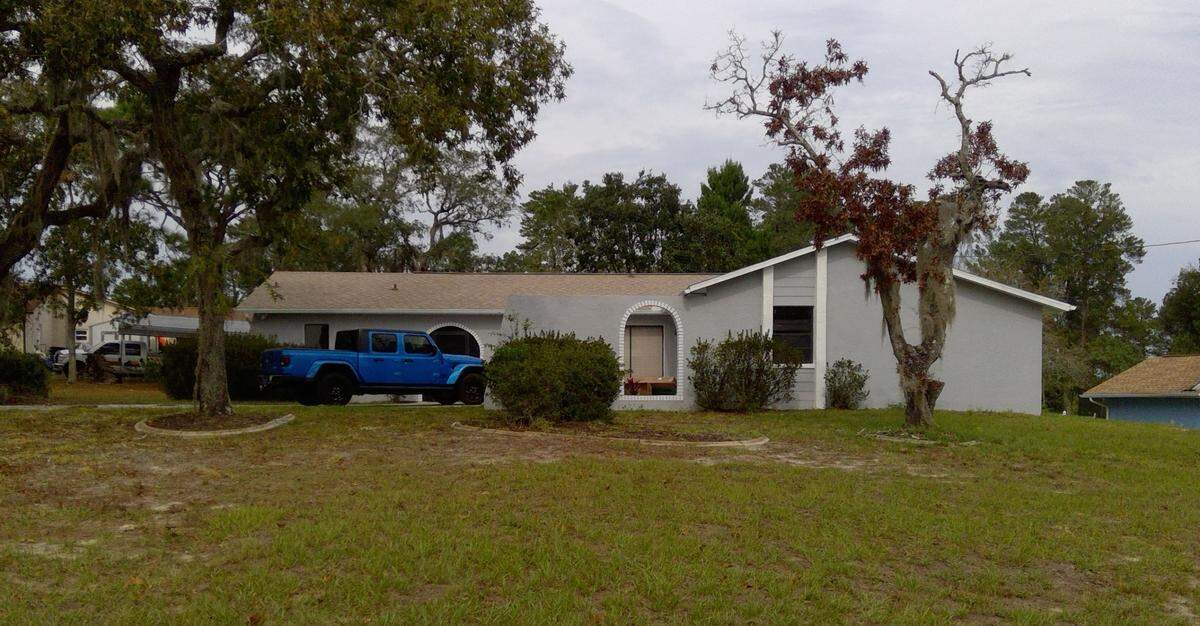 The home in Spring Hill the couple is accused of buying, according to the superseding indictment.