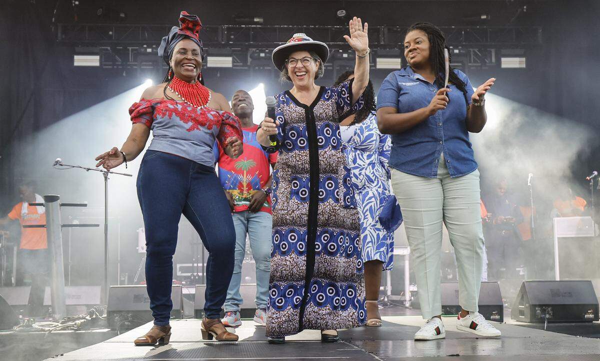 Miami Dade Commissioner Marleine Bastien, Mayor Daniella Levine Cava, and City of North Miami Vice Mayor Kassandra Timothe, left to right, on stage during the 28th Annual Haitian Compas Festival at The NoMI Village celebrating Haitian Flag Day, in North Miami, Florida  on Saturday, May 16, 2026.