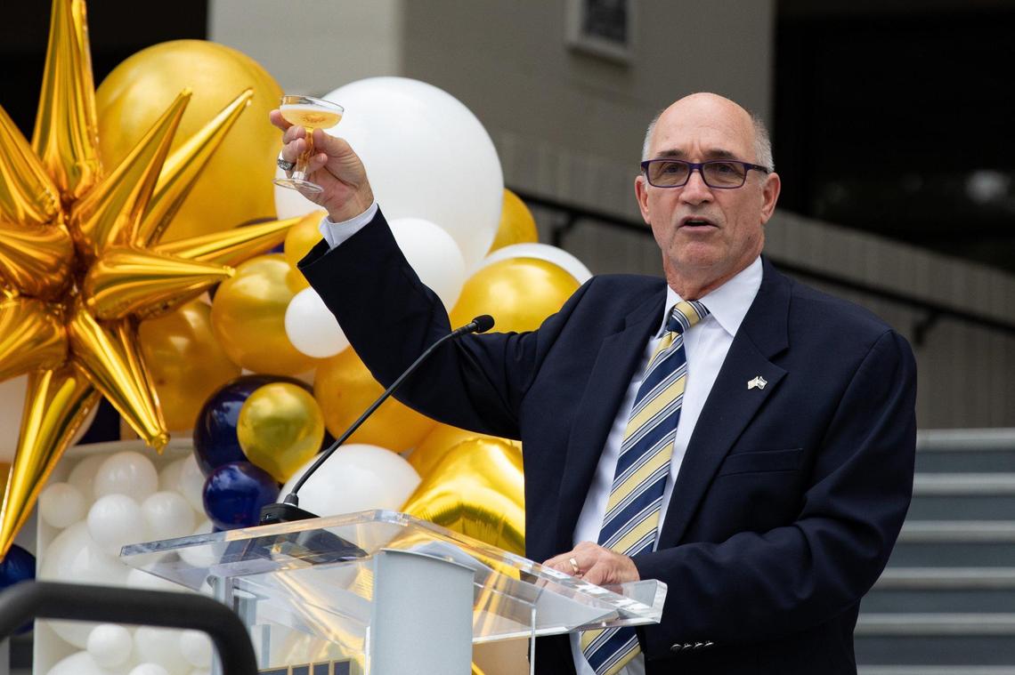 FIU Interim President Dr. Kenneth A. Jessell makes a toast to celebrate FIU’s 50th anniversary on the steps of the Charles Perry Building at the Modesto A. Maidique Campus in Miami, Fla. on Monday, Sept. 19, 2022.