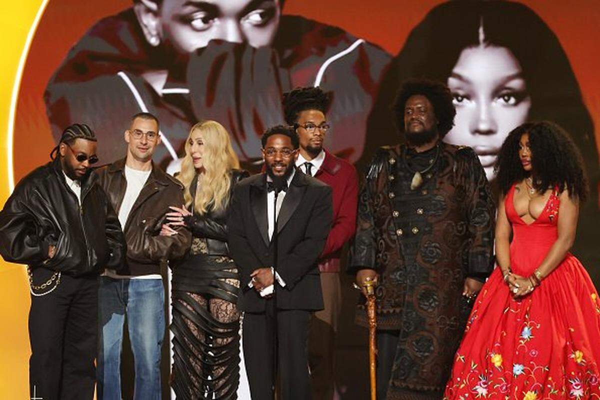 LOS ANGELES, CALIFORNIA - FEBRUARY 01: Cher (3rd L) presents the Record Of The Year award for "luther" to (from L) Sounwave, Jack Antonoff, Kendrick Lamar, Scott Bridgeway, Kamasi Washington, and SZA onstage during the 68th GRAMMY Awards at Crypto.com Arena on February 01, 2026 in Los Angeles, California.  (Photo by Kevin Winter/Getty Images for The Recording Academy)