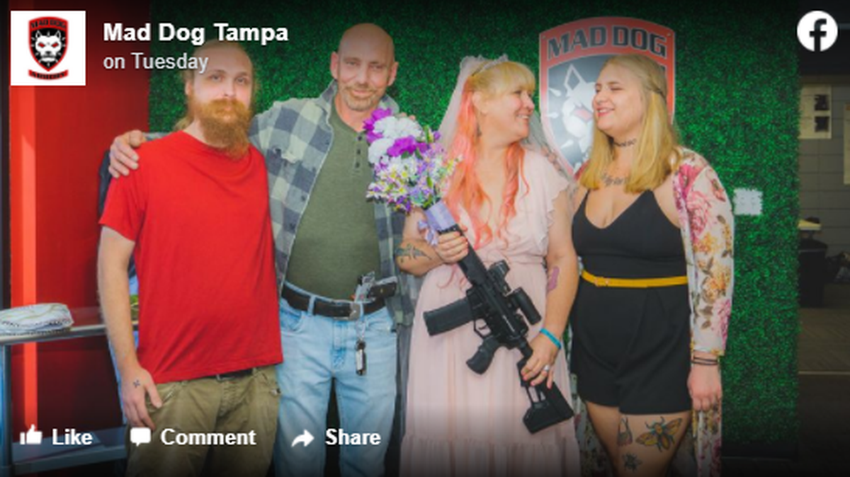 Jennifer and Jason Hahn (center couple) got married at a gun range in Tampa, Florida, and carried weapons during the ceremony on Feb. 22. Attendees included her grown children.