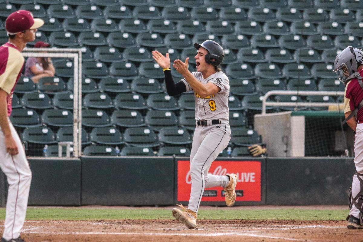 Sunset’s Miguel Gonzalez claps after scoring a run in the second inning on Friday in a Class 4A state semifinal against Citra North Marion at Hammond Stadium in Fort Myers.