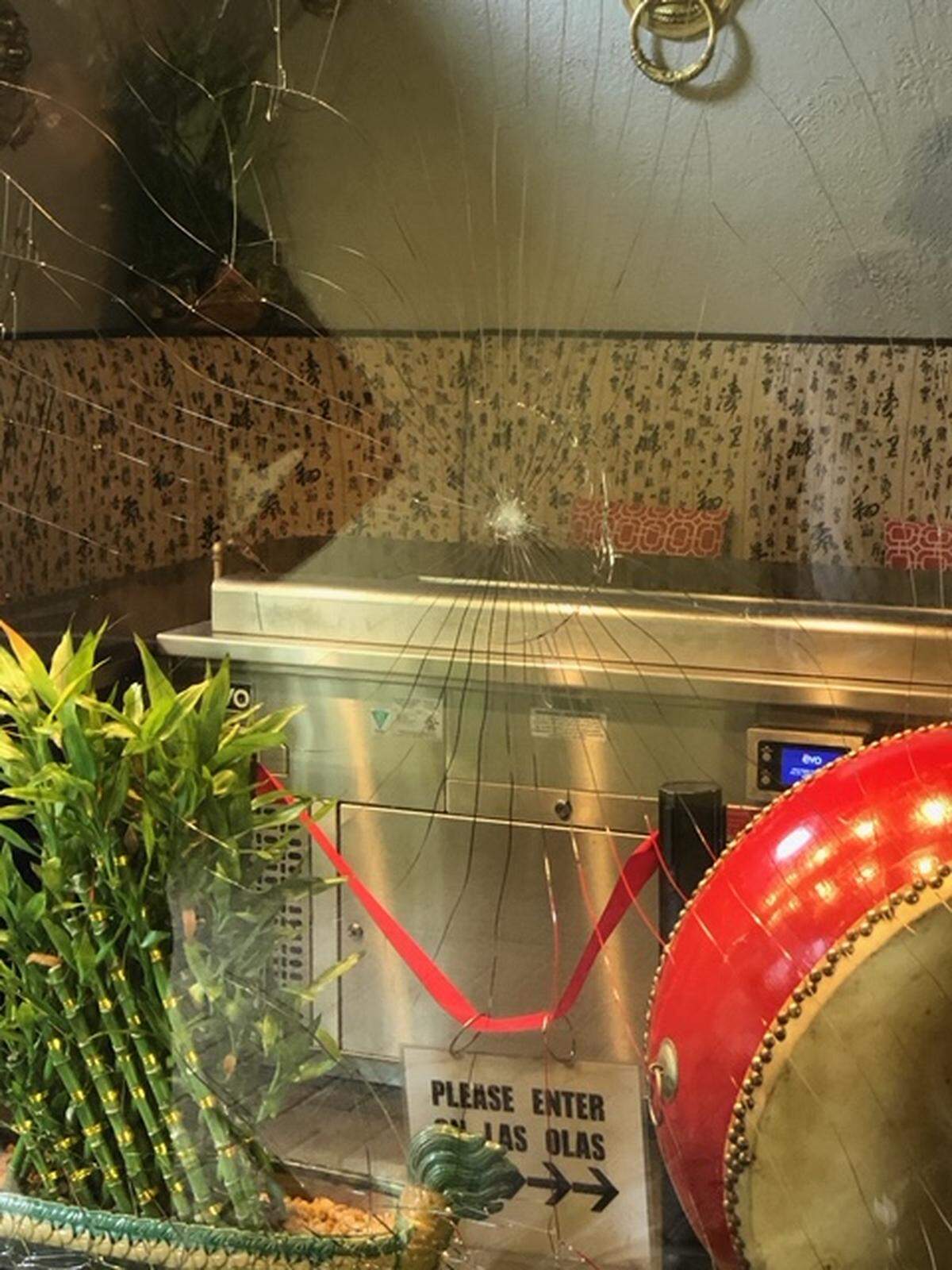 A window outside the Red Door Asian Bistro on Las Olas Boulevard was damaged Sunday morning in an apparent act of vandalism. Fort Lauderdale police are investigating.
