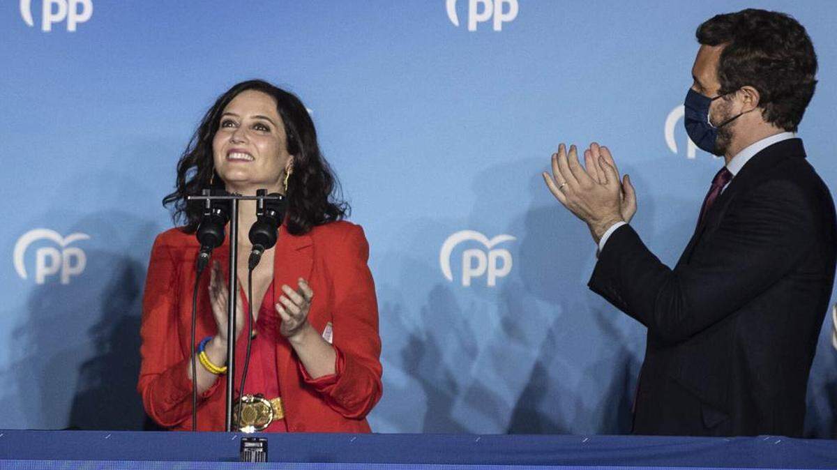 Isabel Diaz Ayuso, left, and Popular party leader Pablo Casasdo celebrate election results in Madrid, Spain, in May 2021.