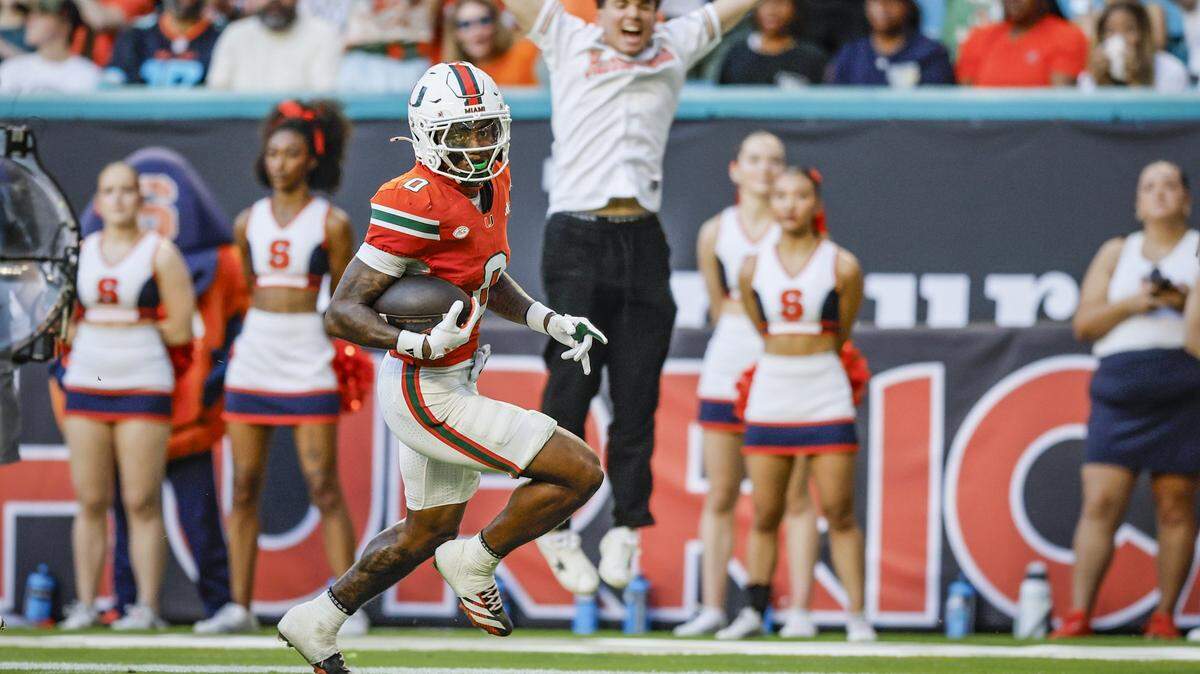 Miami Hurricanes defensive back Keionte Scott (0) scors a pick six in the first half during an NCAA football game at Hard Rock Stadium against Syracuse Orange in Miami Gardens, Florida on Saturday, November 8, 2025.