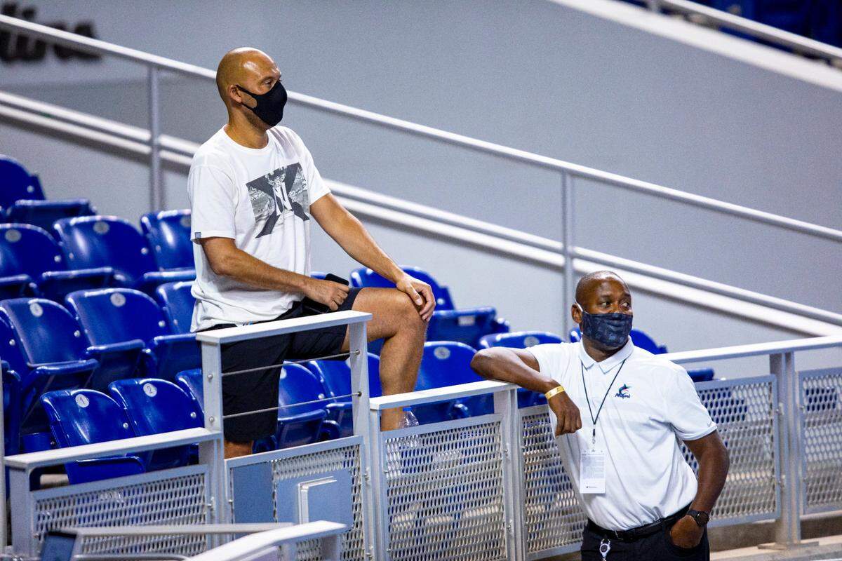 Marlins CEO Derek Jeter and president of baseball operations Michael Hill watch players bat during a simulation game at Marlins Park in Miami, Florida on Friday, July 10, 2020.