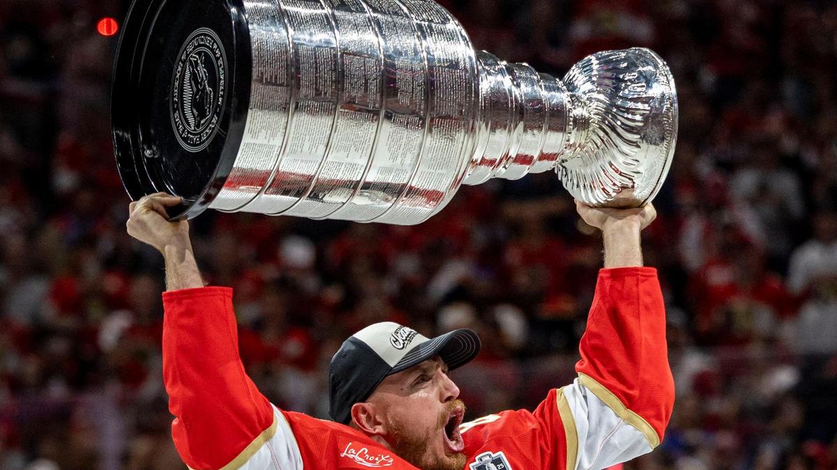 Florida Panthers defenseman Nate Schmidt (88) lifts the Stanley Cup after the Panthers defeated the Edmonton Oilers in Game 6 on Thursday, June 17, 2025, in Sunrise, Fla.