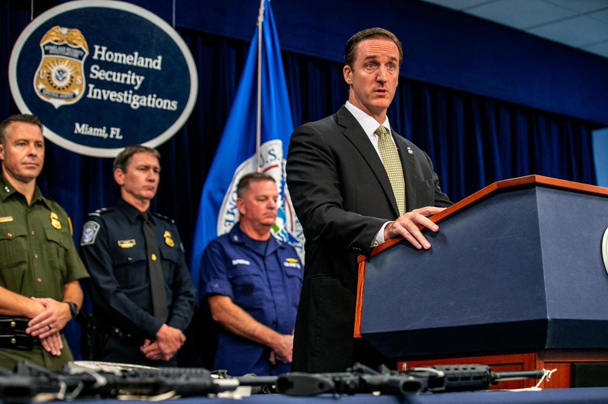 Anthony Salisbury, special agent in charge of Homeland Security Investigations in Miami, is joined by other law enforcement officials as he announces a crackdown Wednesday on firearms and ammunition smuggling to Haiti.