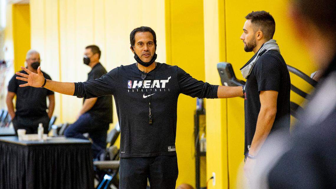 Miami Heat Head Coach Erik Spoelstra, left, speaks with forward Max Strus, right, during practice at FTX Arena in Miami, Florida, on Thursday, September 30, 2021.
