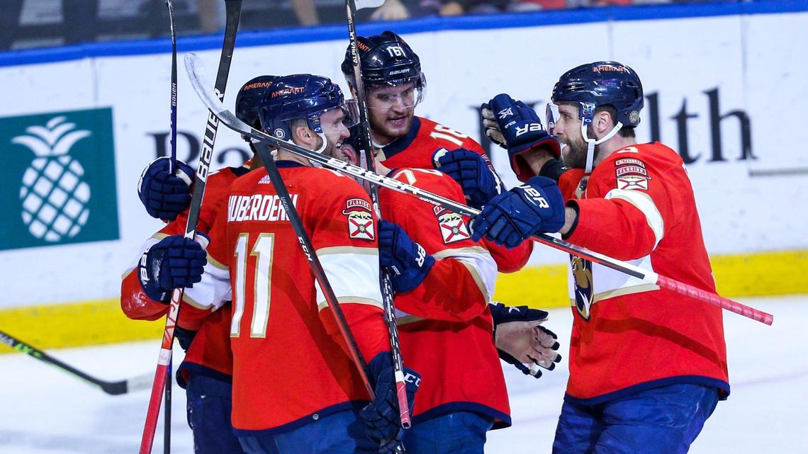 Florida Panthers players surround right wing Patric Hornqvist (70) after he scored on Calgary Flames goalie Jacob Markstrom (25) during the first period of an NHL game at FLA Live Arena in Sunrise, Florida, on Tuesday, January 4, 2022.