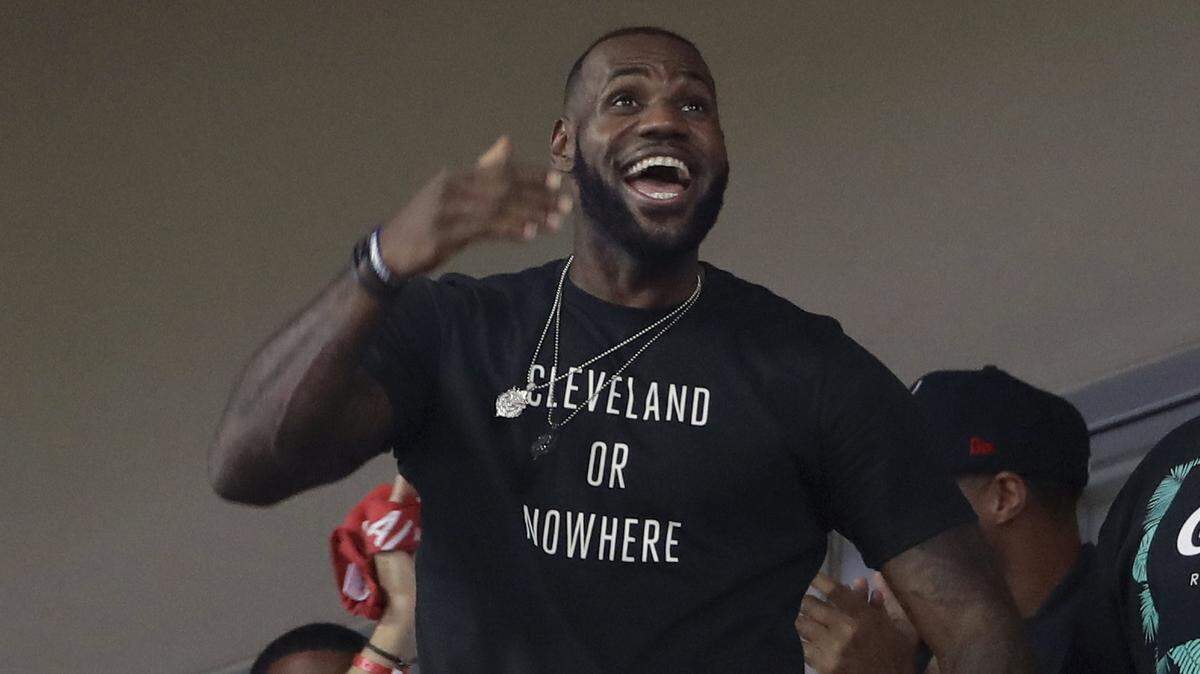 LeBron James watches during the eighth inning of Game 7 of the baseball World Series between the Cleveland Indians and the Chicago Cubs in Cleveland. The four-time NBA MVP announced Sunday night, July 1, 2018, that he has agreed to a four-year, $154 million contract with the Los Angeles Lakers.