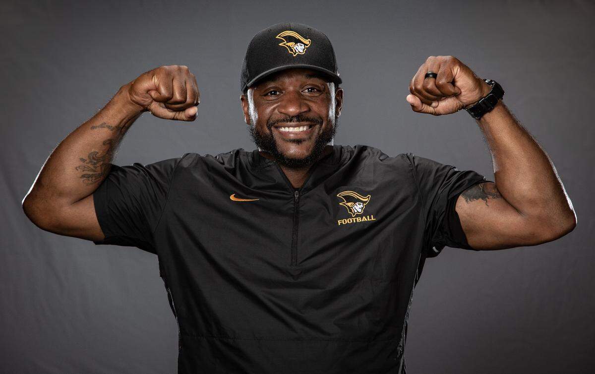 American Heritage coach Patrick Surtain poses during High School Football Media Day at Hard Rock Stadium on Saturday, August 4, 2018.
