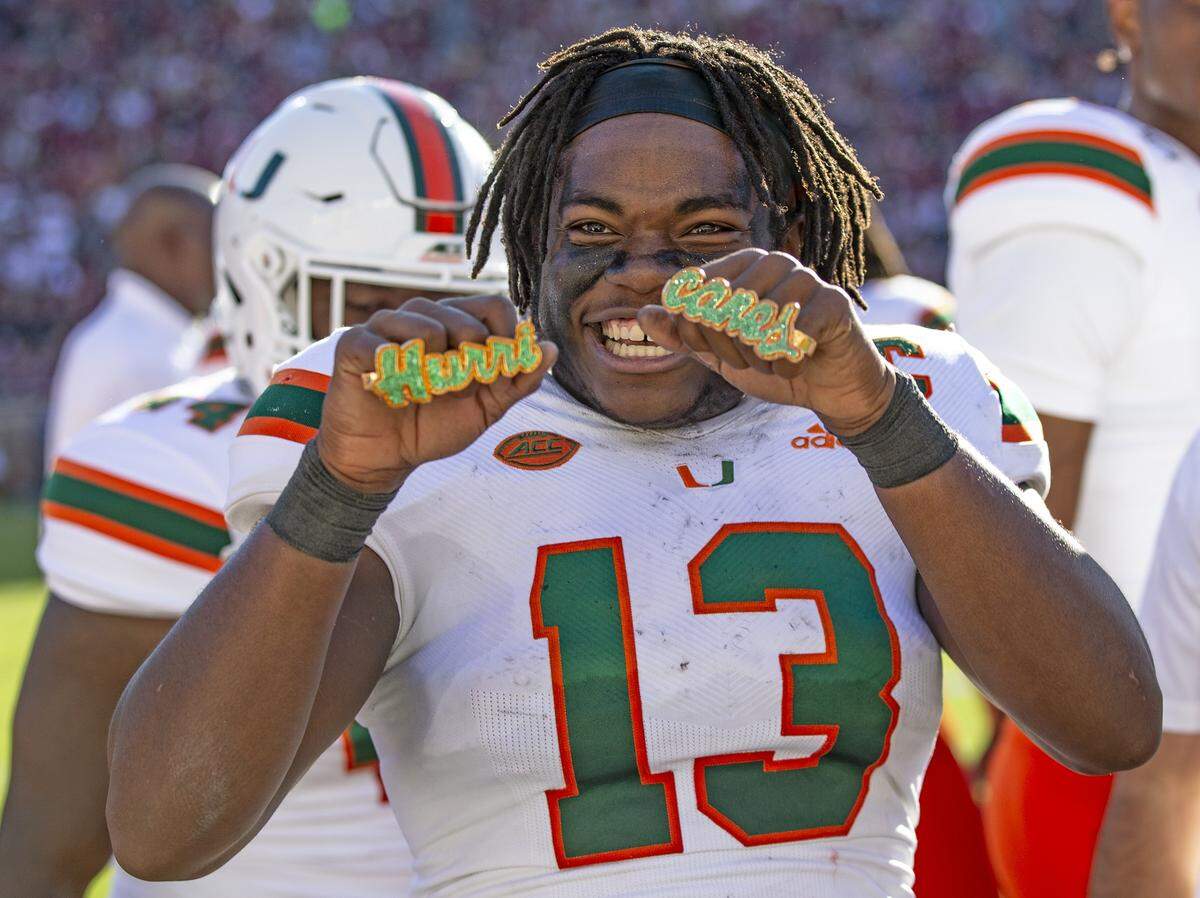 Miami Hurricanes running back DeeJay Dallas (13) with the Touch Down Rings after scoring in the second quarter as the Seminoles host the Miami Hurricanes at Doak Campbell Stadium in Tallahassee on Saturday, November 2, 2019.