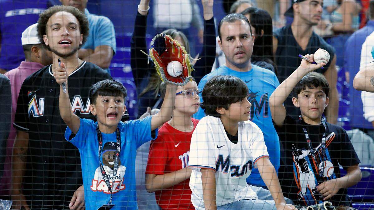 young baseball fans call out to players for autographs after the game between the Miami Marlins and the San Diego Padres at loanDepot Park in Miami on Wednesday, May 31, 2023.