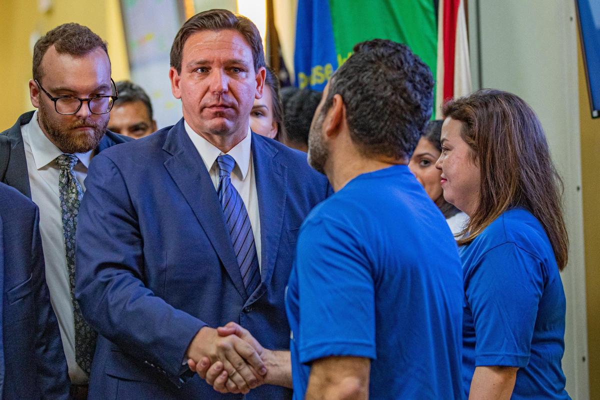 Florida Gov. Ron DeSantis shakes hands with a member of the Florida Department of Transportation while leaving a press conference regarding toll relief at the Florida Department of Transportation District 6 Headquarters in Miami, Florida, on Wednesday, Sept. 7, 2022.
