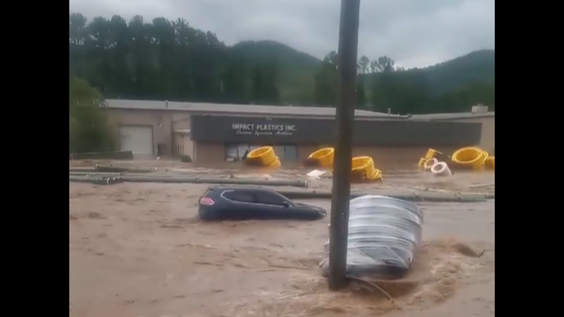 Multiple videos were posted on Facebook showing how fast and swift waters became outside Impact Plastics in Erwin, Tennessee.