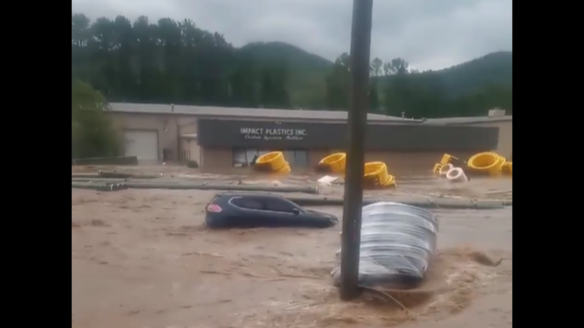 Multiple videos were posted on Facebook showing how fast and swift waters became outside Impact Plastics in Erwin, Tennessee.